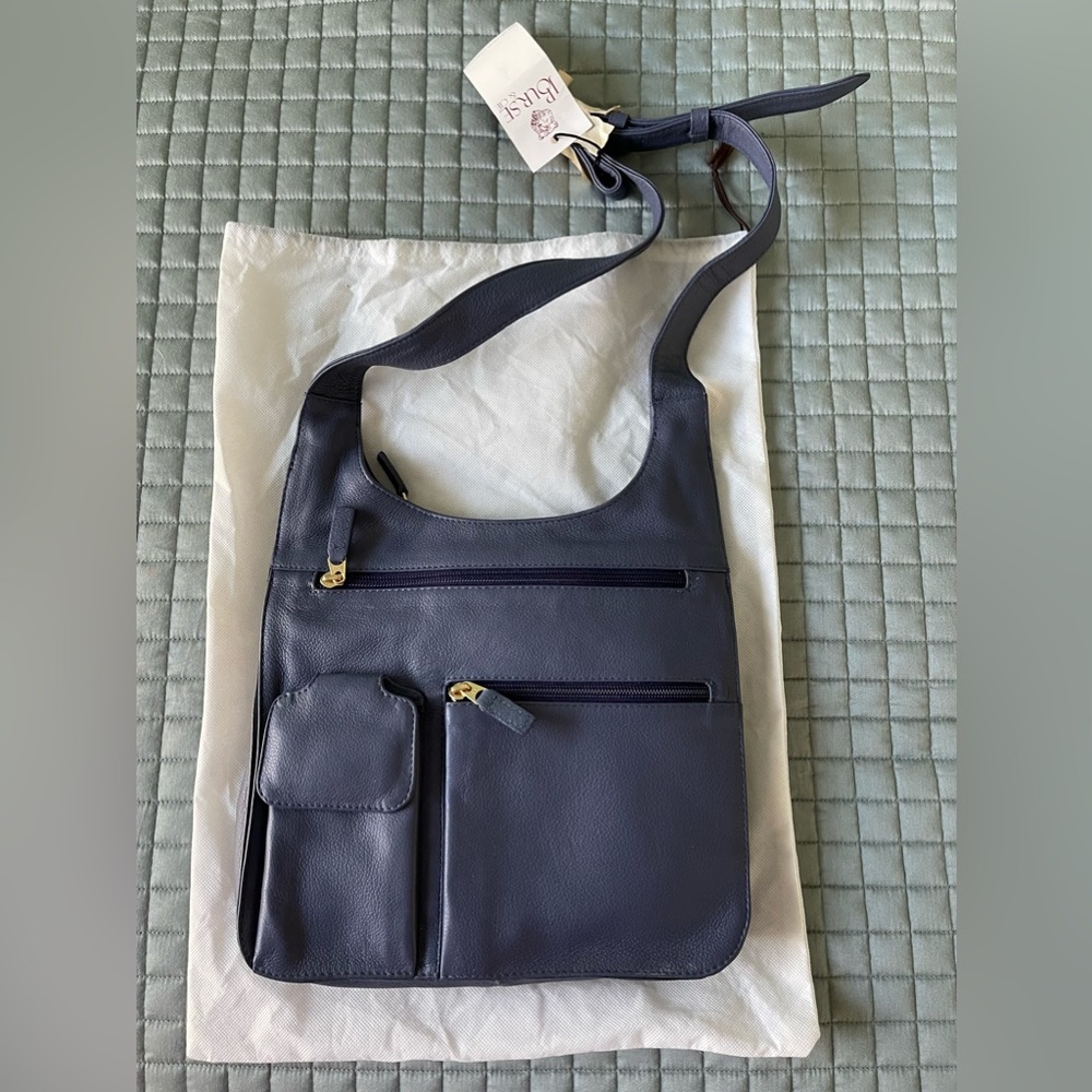 JPOurse travel bag crossbody. Blue leather. Brand new with tags.
